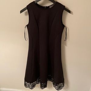 NEW black dress with sleek form fitting design